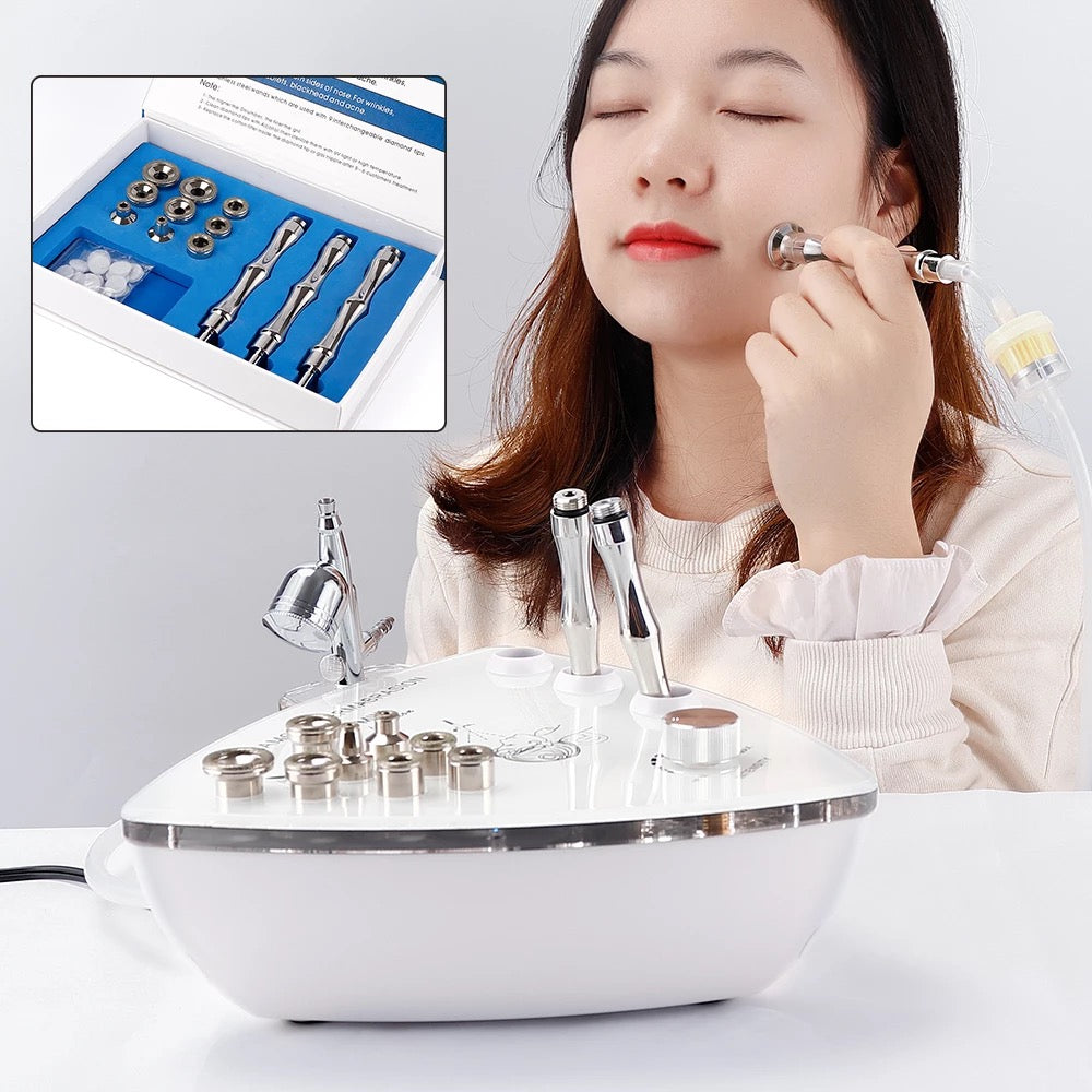 Woman Using Diamond Microdermabrasion Machine on Face, Box with Machine Parts