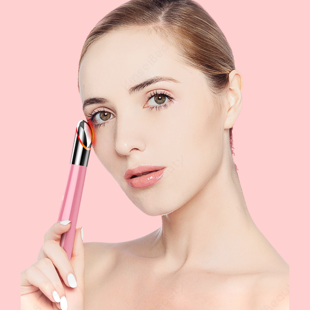 Woman using Pink color Skin Rejuvenating Eye Massager Pen